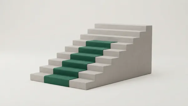 A grey clay staircase with a green runner up most of the steps, the top two steps bare